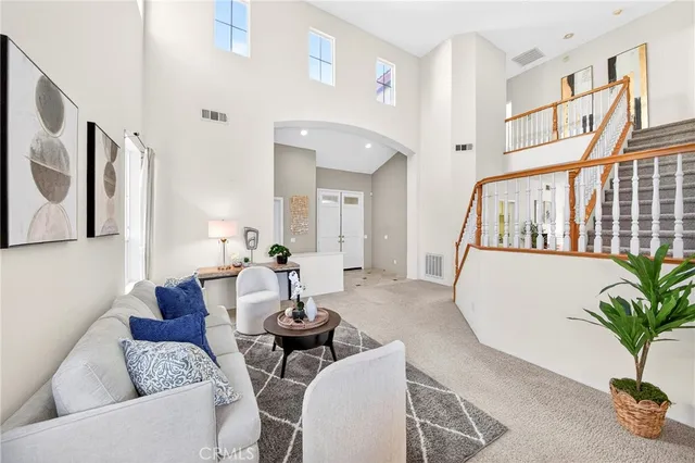 a bathroom with a shower sink vanity mirror and toilet