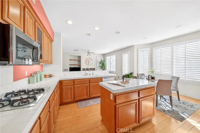 a dining room with a sink a dining table and chairs