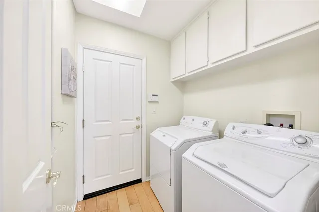 a spacious bedroom with a bed and a large window