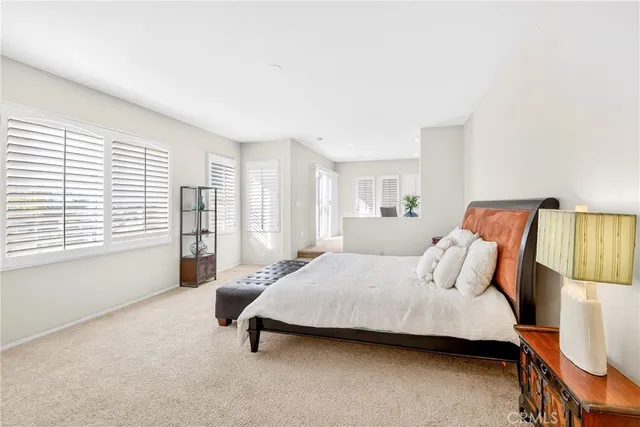 a bathroom with a sink vanity mirror bathtub and toilet