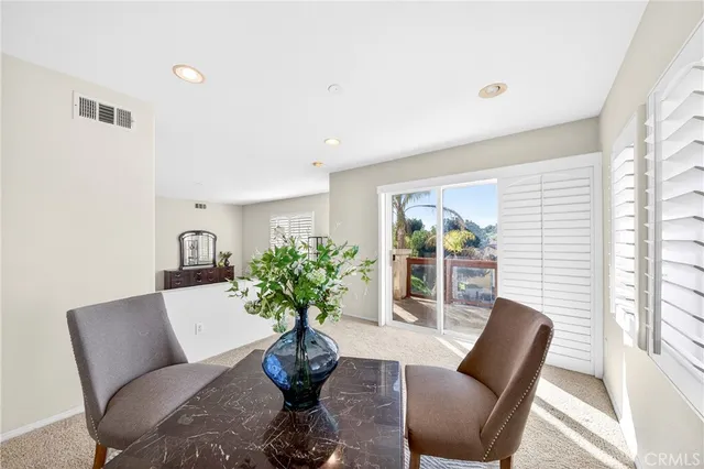 a view of a hallway with wooden floor and entryway