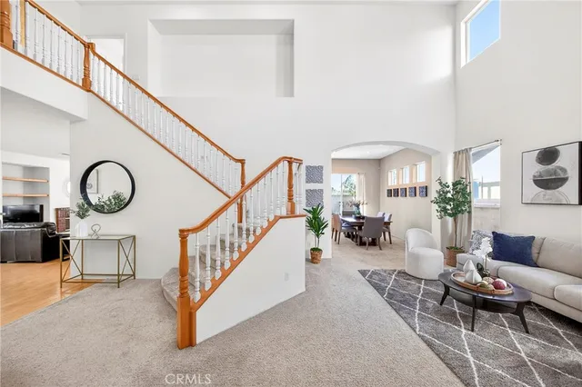a living room with furniture and white walls