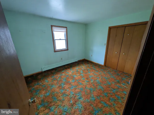 an empty room with a hallway
