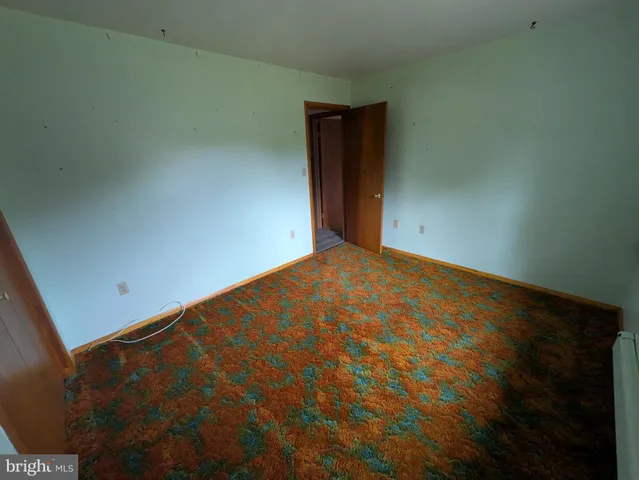 a view of entryway with livingroom