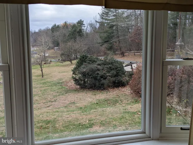 a view of a glass door and a window