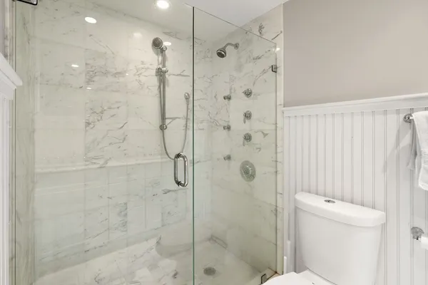 a bathroom with a shower and a toilet