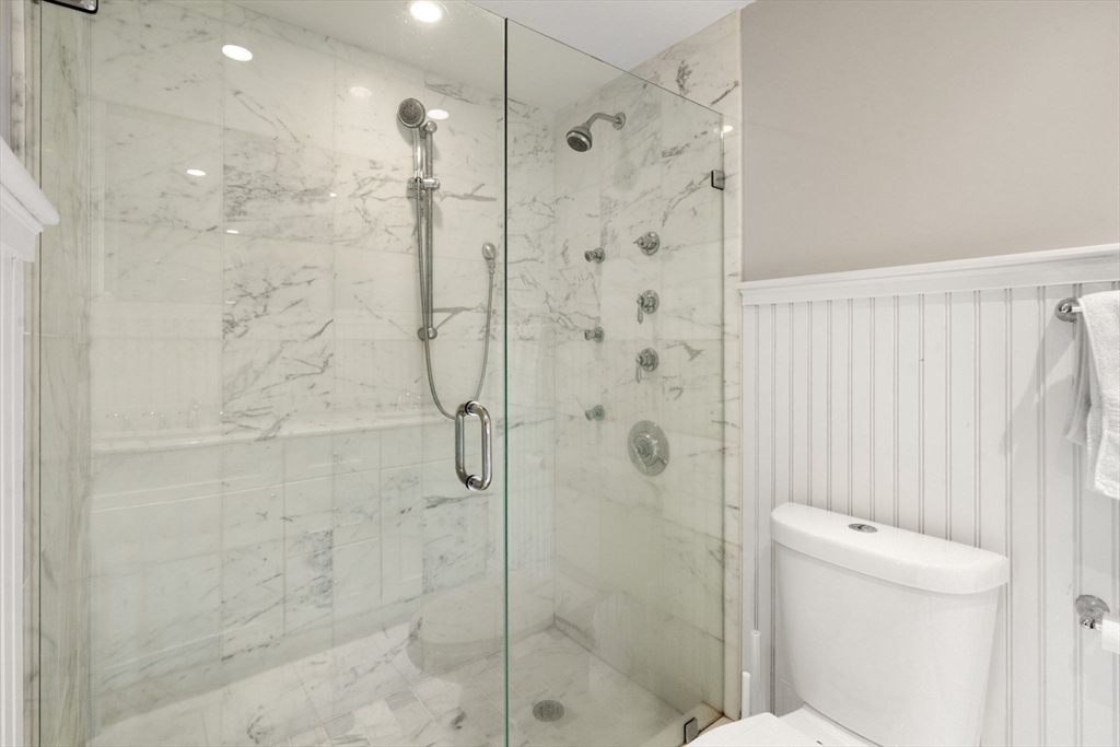 215 Athens Street, Unit 4 Boston, MA 02127 - Photo 13 of 19 a bathroom with a shower and a toilet