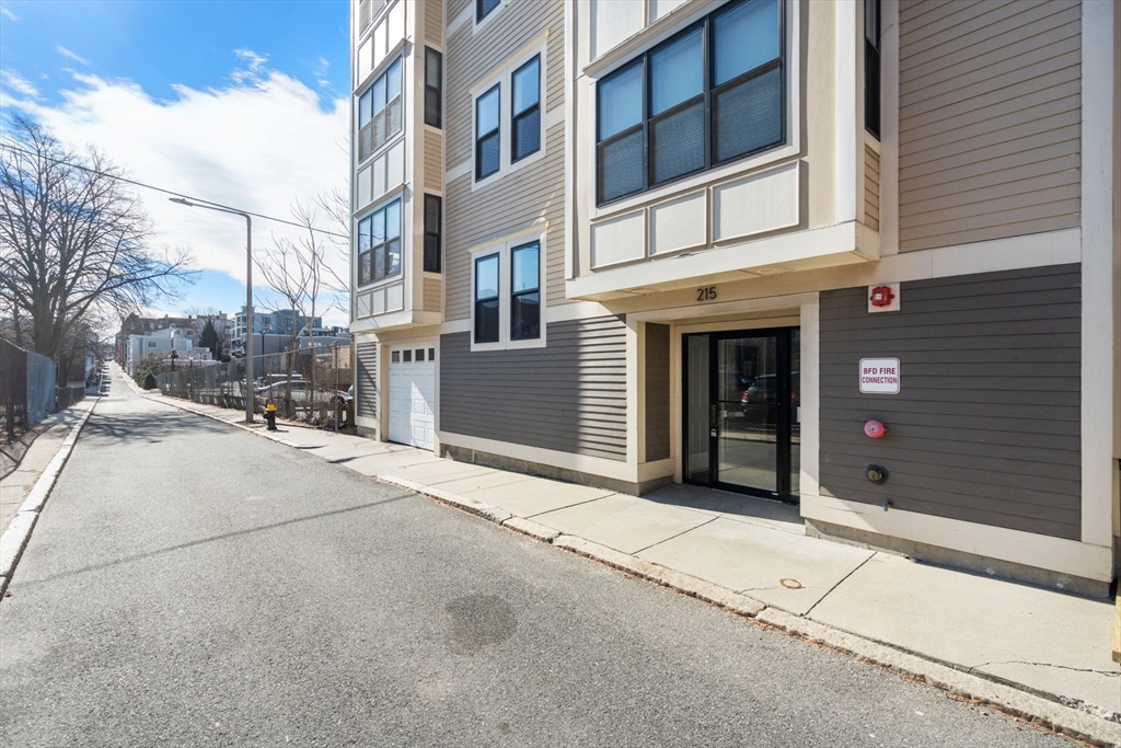215 Athens Street, Unit 4 Boston, MA 02127 - Photo 18 of 19 a view of a building with a street