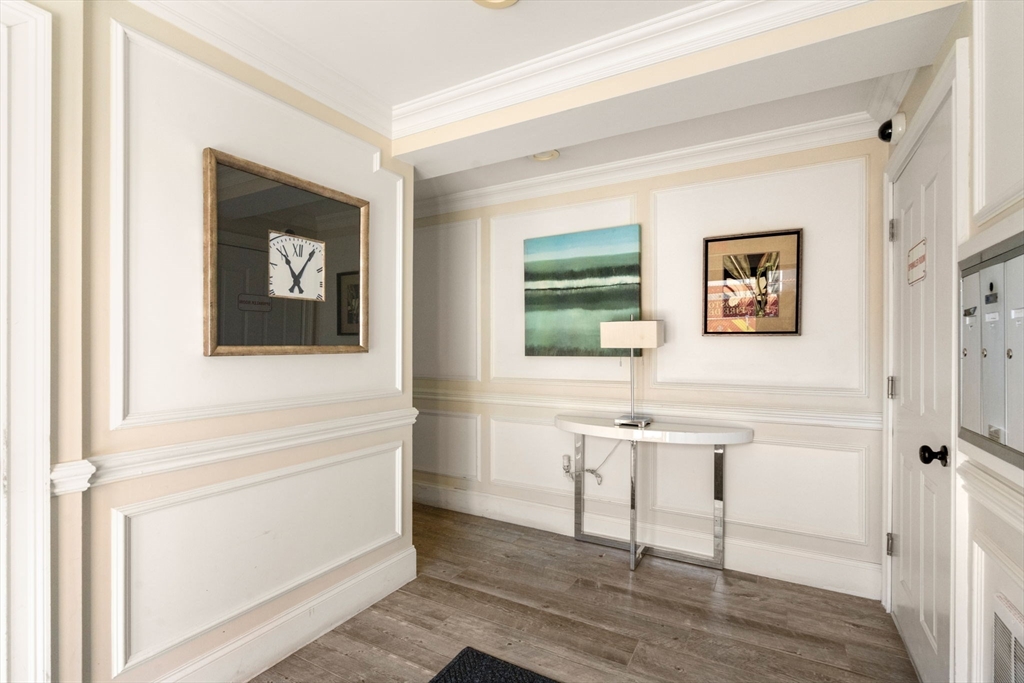 215 Athens Street, Unit 4 Boston, MA 02127 - Photo 3 of 19 a view of a livingroom with table and chair