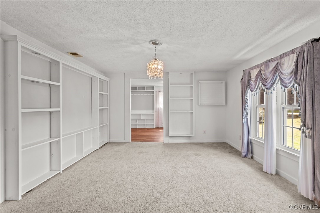 11021 Cosby Mill Road Quinton, VA 23141 - Photo 11 of 43 Unfurnished dining area with a notable chandelier,