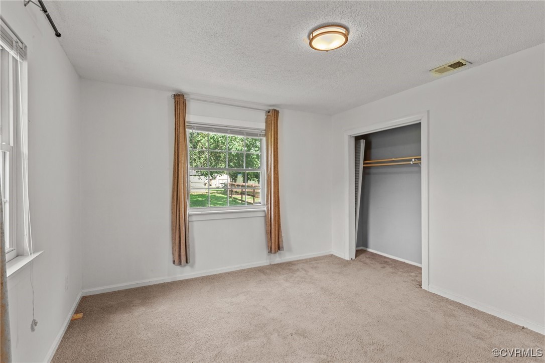 11021 Cosby Mill Road Quinton, VA 23141 - Photo 19 of 43 Unfurnished bedroom featuring a textured ceiling,