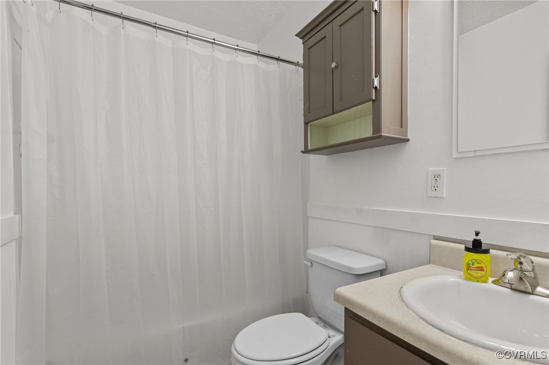 11021 Cosby Mill Road Quinton, VA 23141 - Photo 21 of 43 Bathroom featuring vanity, a textured ceiling, and