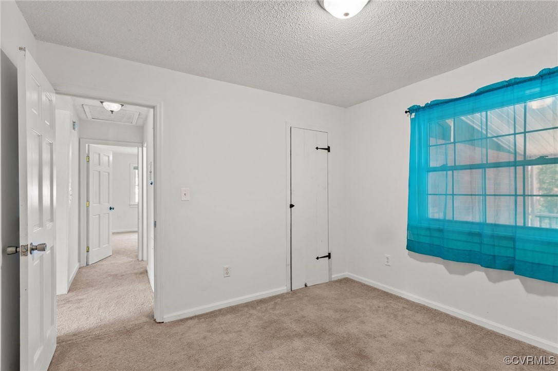 11021 Cosby Mill Road Quinton, VA 23141 - Photo 26 of 43 Unfurnished bedroom featuring a textured ceiling a