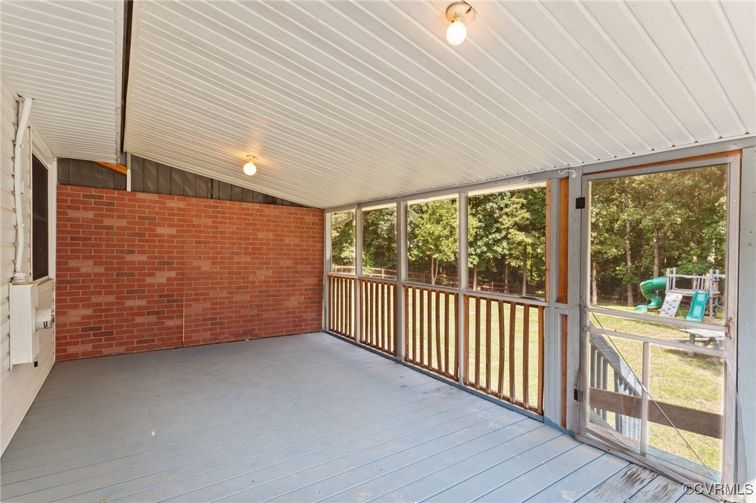 11021 Cosby Mill Road Quinton, VA 23141 - Photo 32 of 43 Unfurnished sunroom with vaulted ceiling