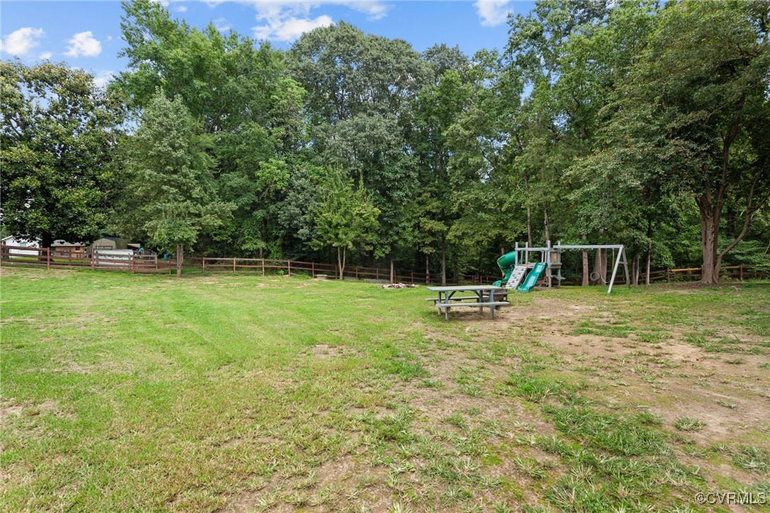 11021 Cosby Mill Road Quinton, VA 23141 - Photo 42 of 43 View of yard featuring a playground