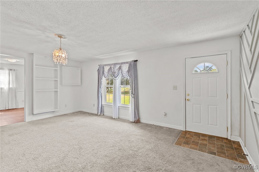11021 Cosby Mill Road Quinton, VA 23141 - Photo 9 of 43 Carpeted entryway with a textured ceiling and an i
