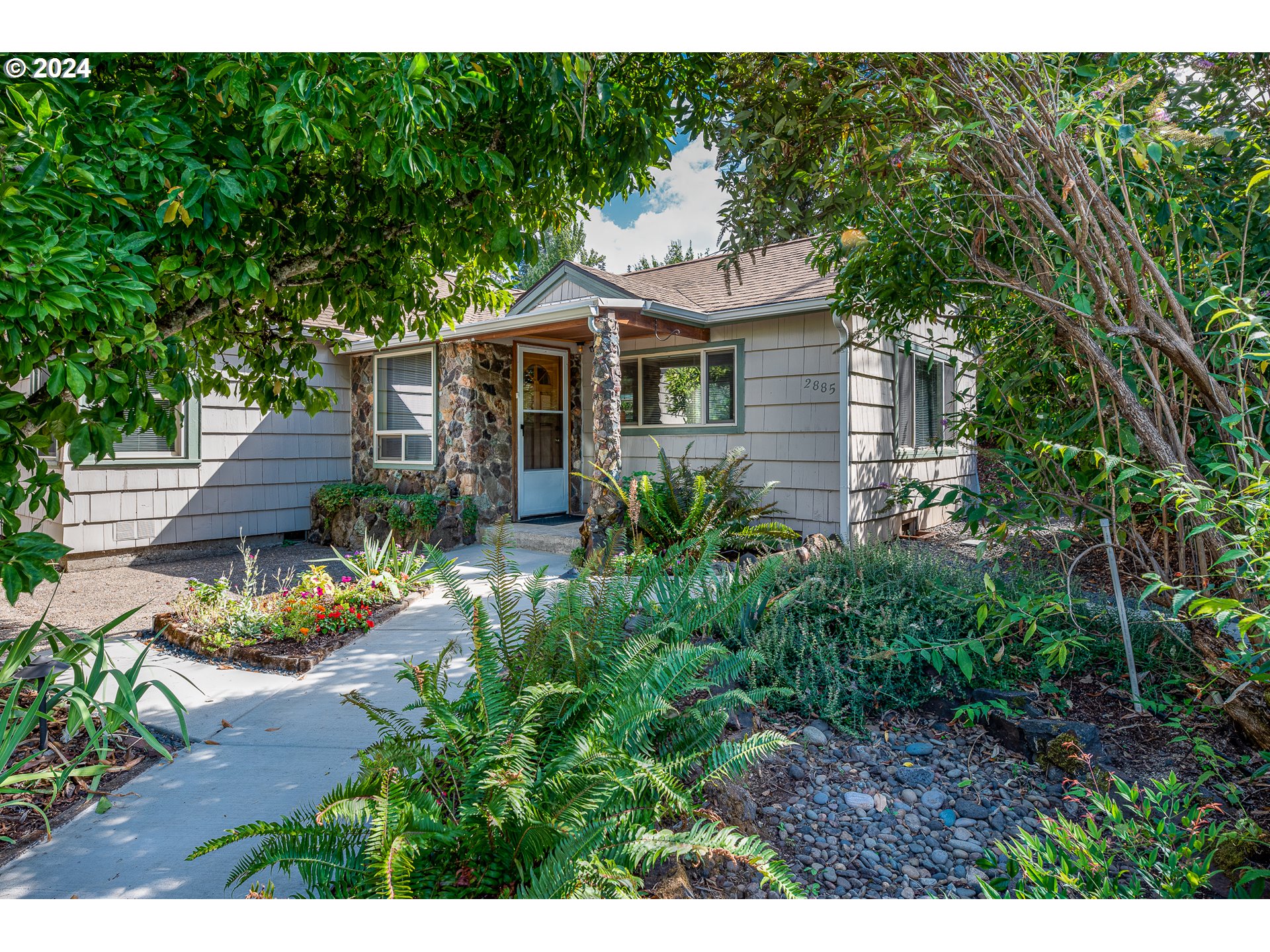 2875 Adams Street Eugene, OR 97405 - Photo 1 of 47 a front view of a house with a yard