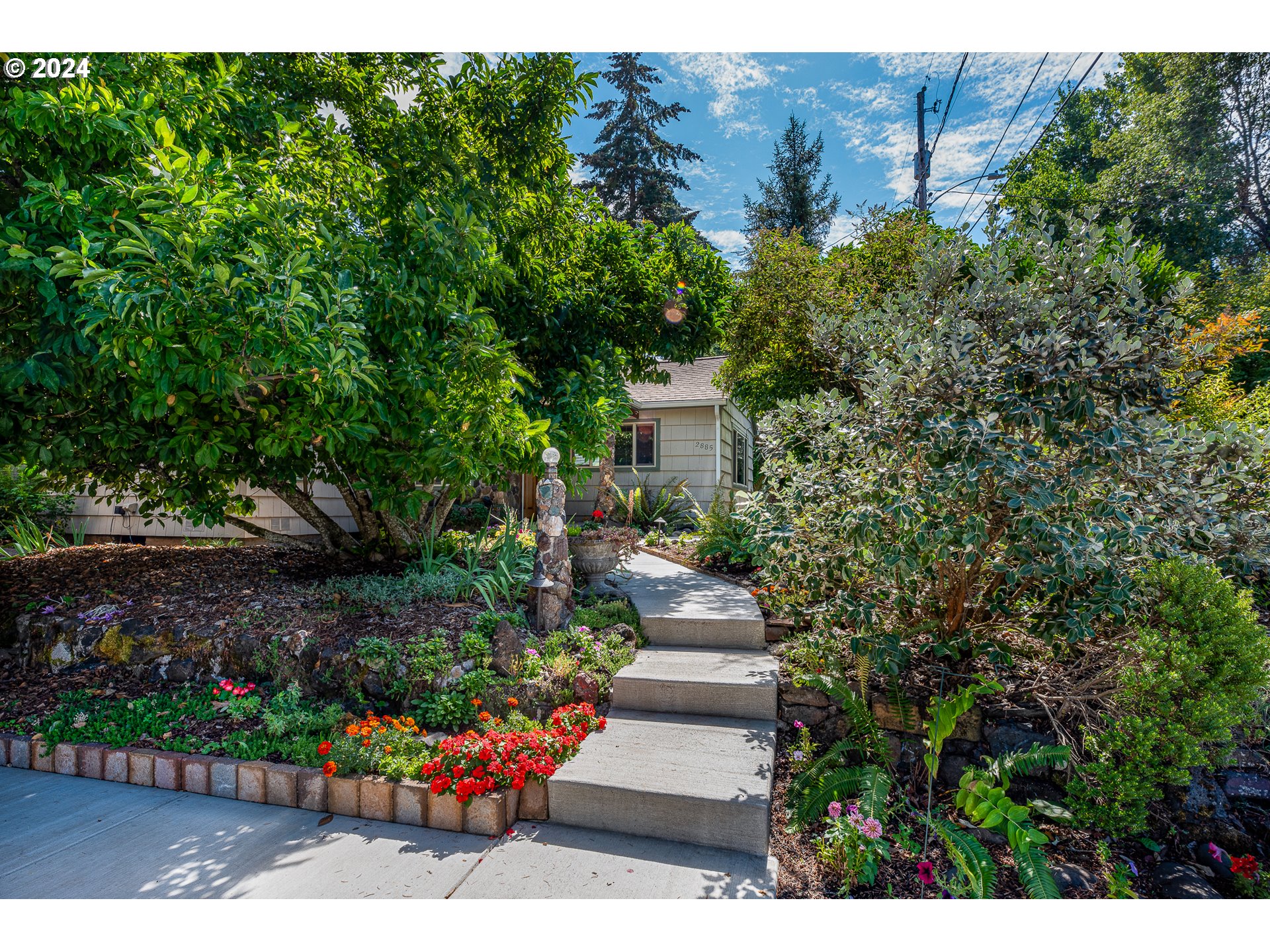 2875 Adams Street Eugene, OR 97405 - Photo 2 of 47 a view of a garden with potted plants