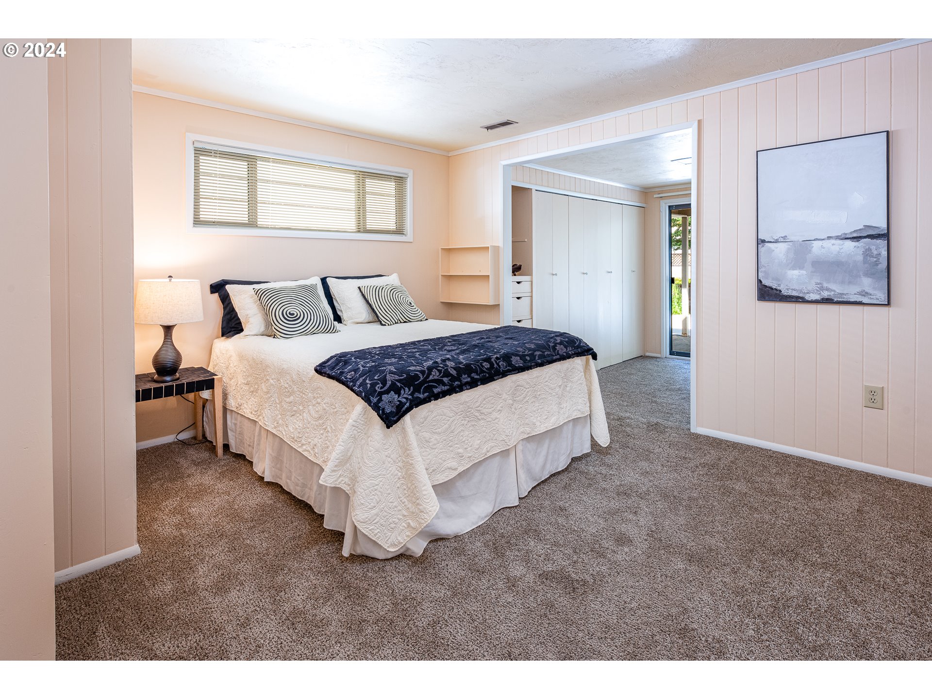 2875 Adams Street Eugene, OR 97405 - Photo 25 of 47 a spacious bedroom with a bed and window