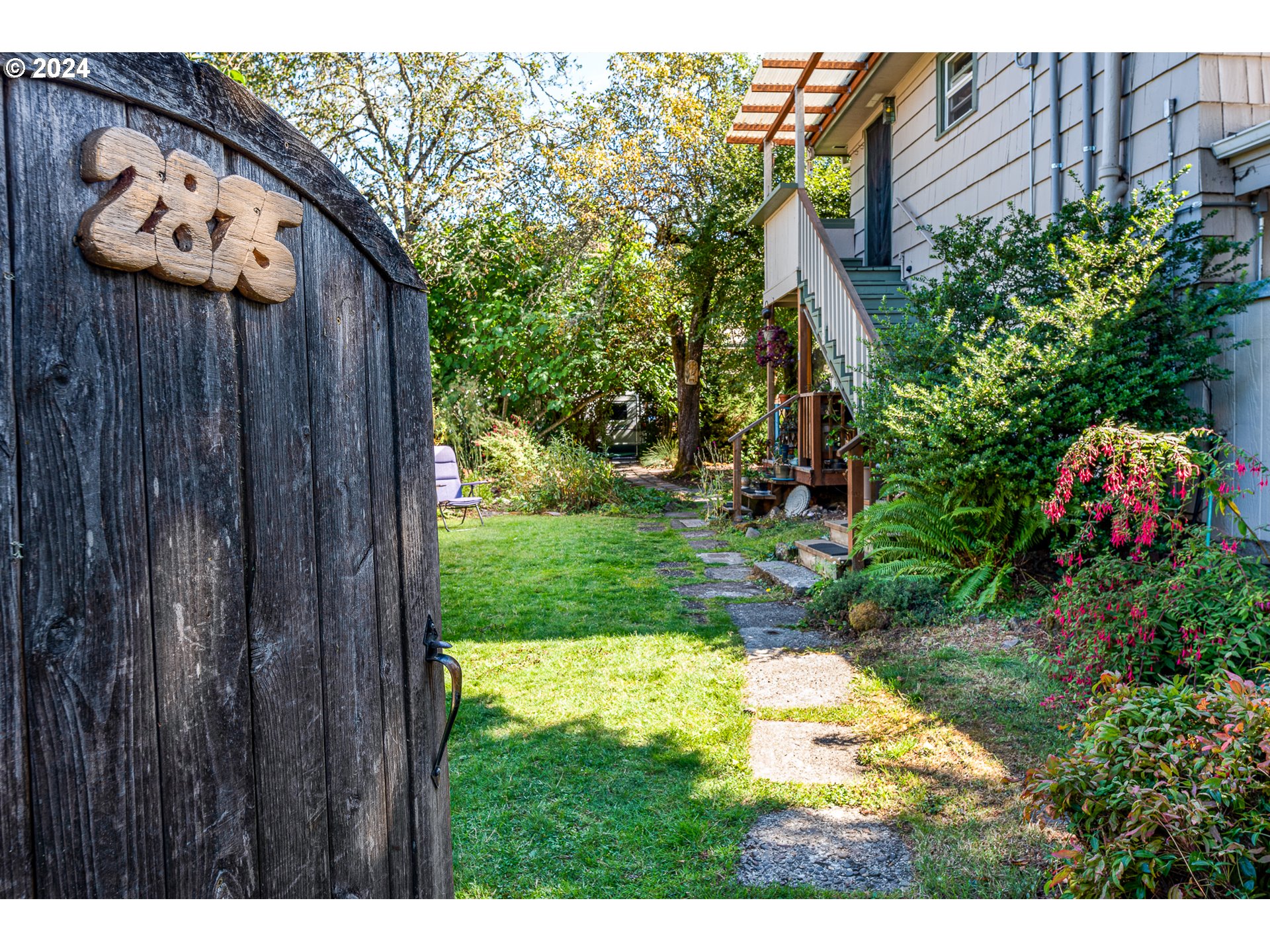 2875 Adams Street Eugene, OR 97405 - Photo 28 of 47 a backyard of a house with lots of green space