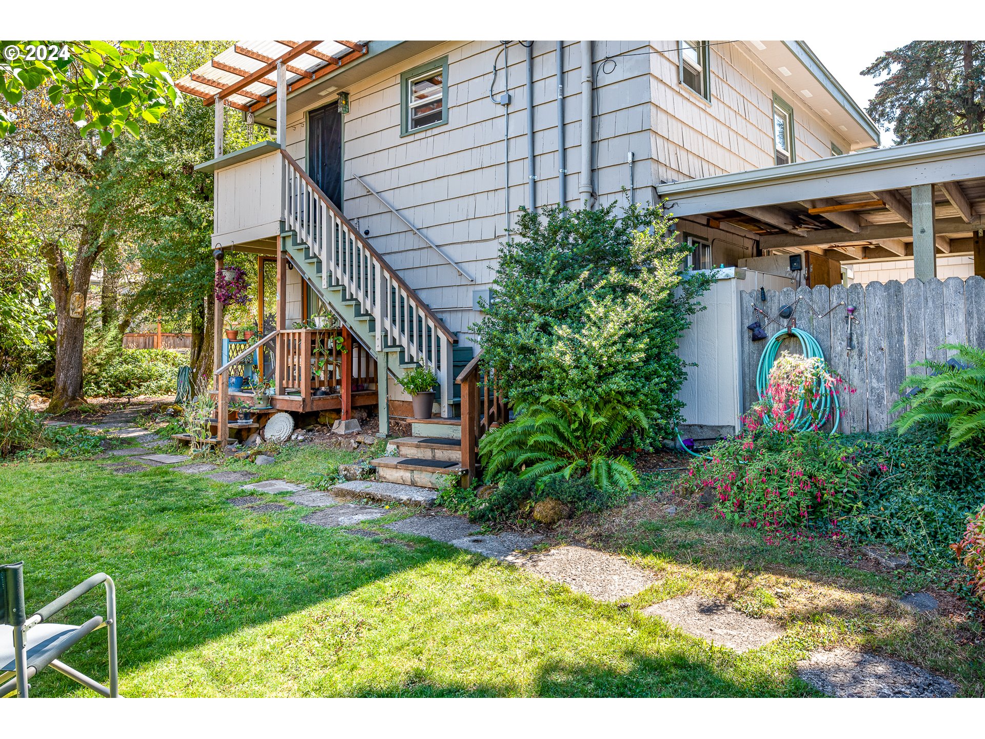 2875 Adams Street Eugene, OR 97405 - Photo 29 of 47 a view of an house with backyard space and garden