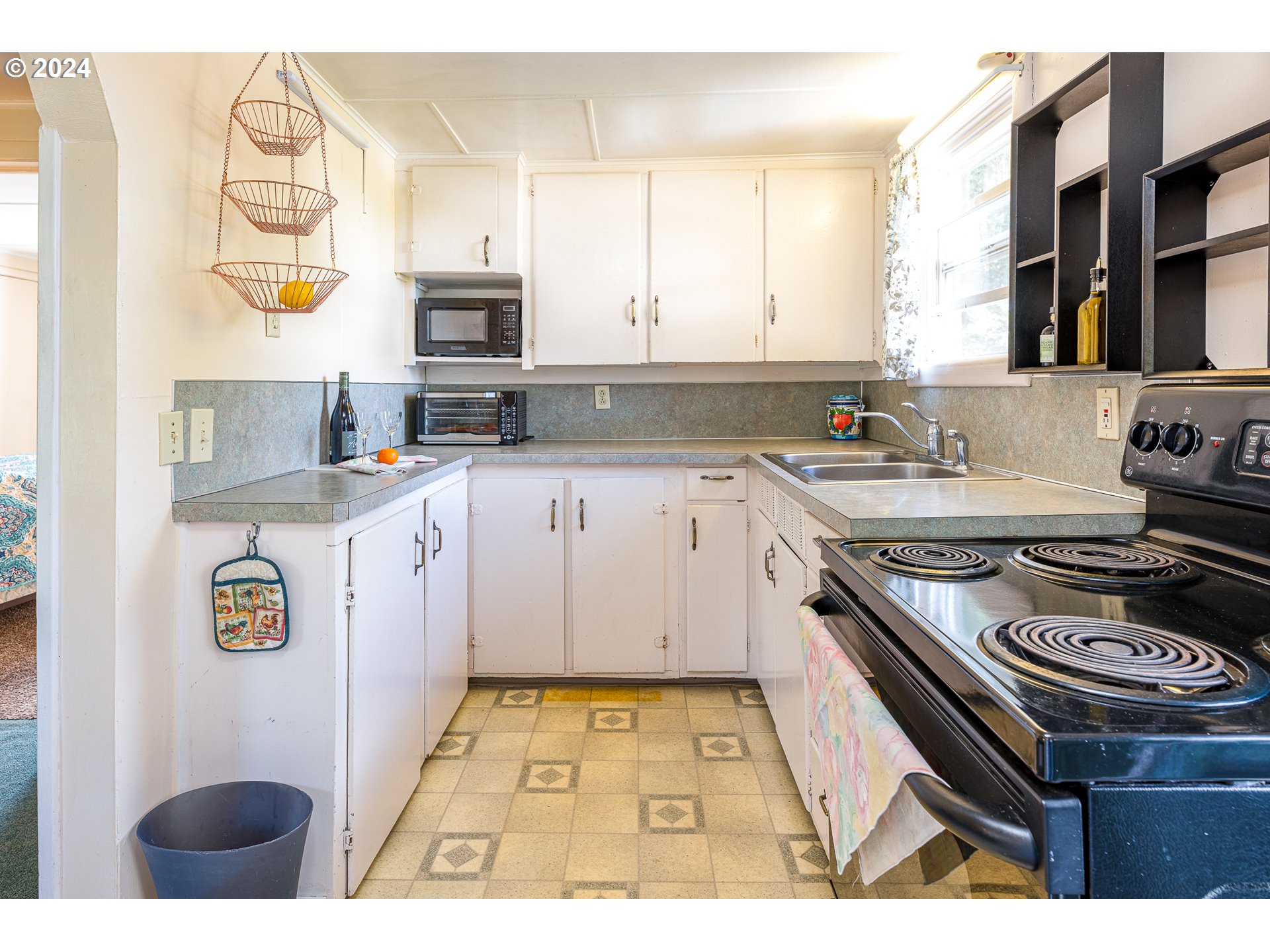 2875 Adams Street Eugene, OR 97405 - Photo 32 of 47 a kitchen with a sink stove and microwave