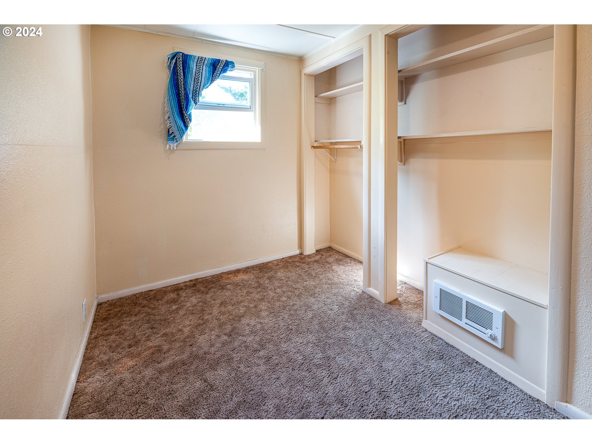 2875 Adams Street Eugene, OR 97405 - Photo 35 of 47 a view of an empty room with closet and a window