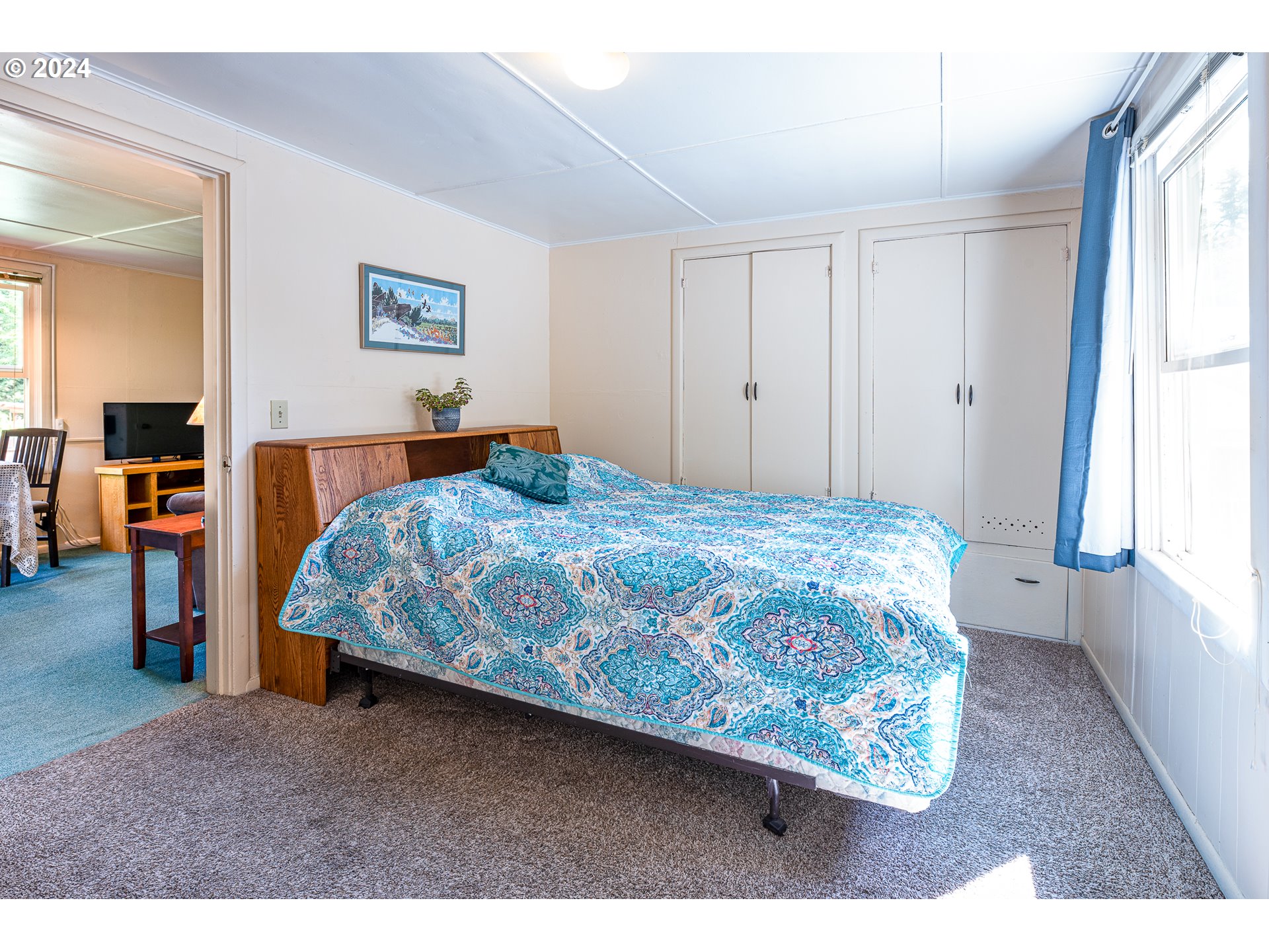2875 Adams Street Eugene, OR 97405 - Photo 36 of 47 a bedroom with a bed and a view of kitchen