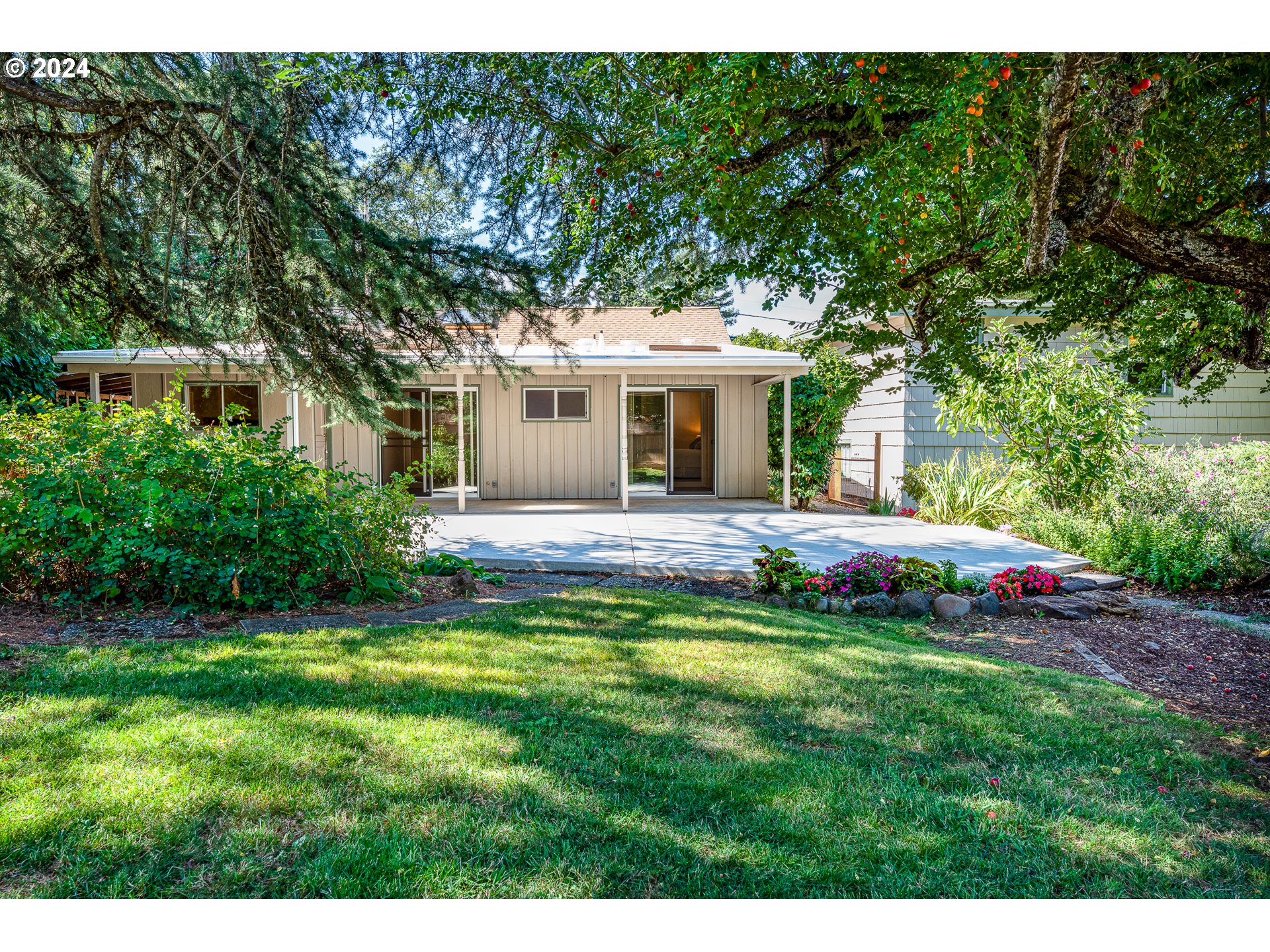 2875 Adams Street Eugene, OR 97405 - Photo 40 of 47 a view of a house with a backyard porch and sitting area