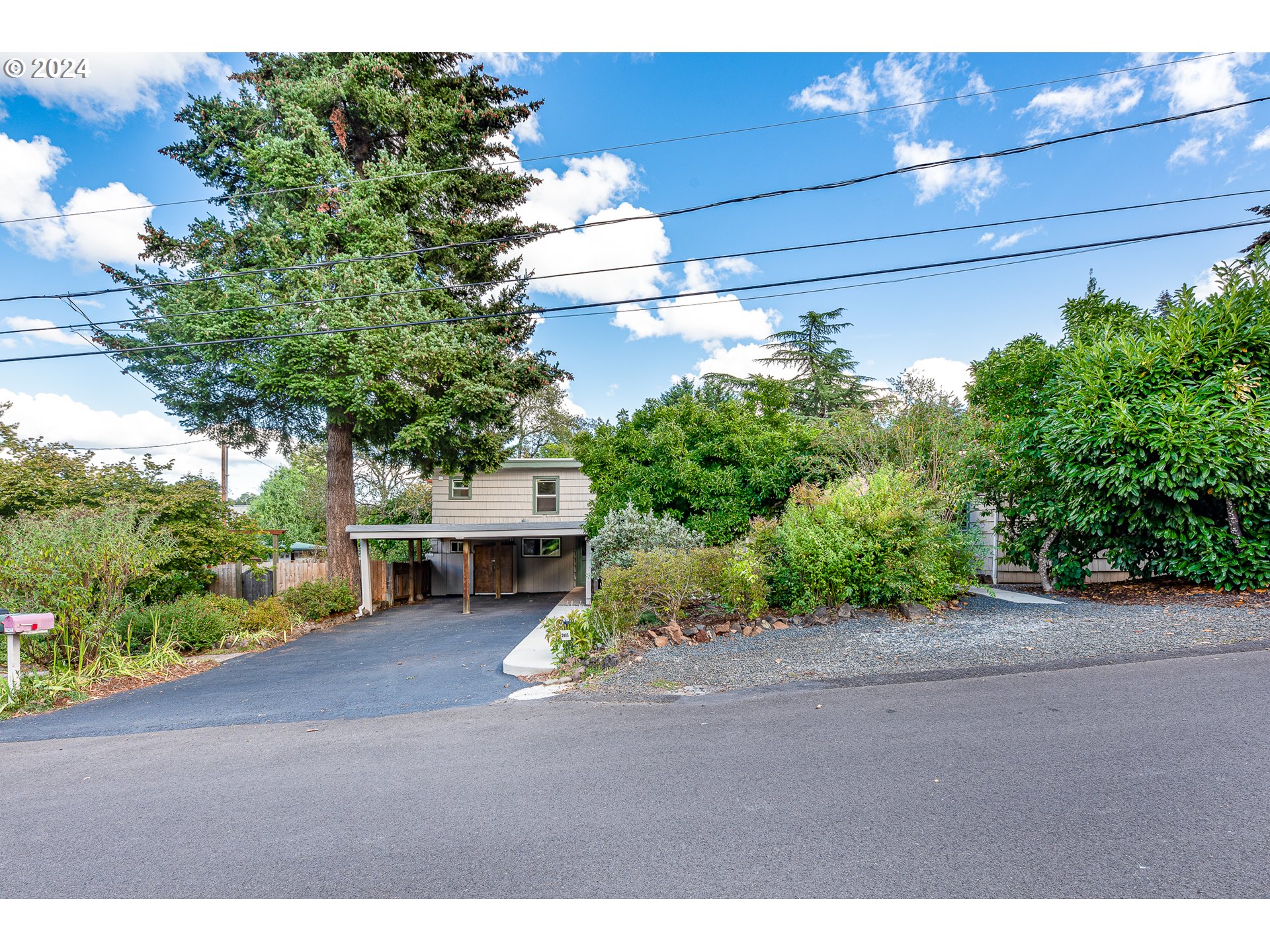 2875 Adams Street Eugene, OR 97405 - Photo 4 of 47 a front view of a house with a yard and garage