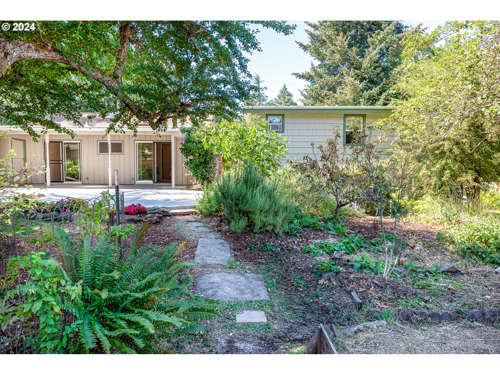 2875 Adams Street Eugene, OR 97405 - Photo 41 of 47 a backyard of a house with table and chairs