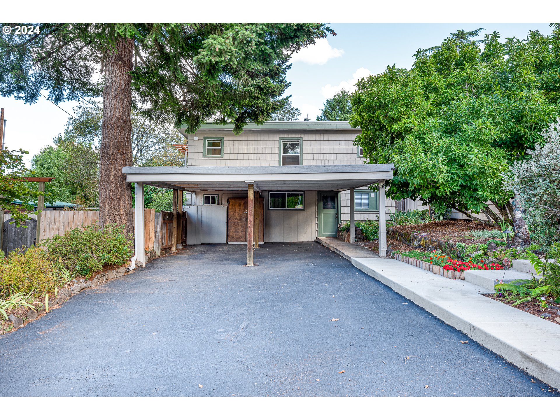 2875 Adams Street Eugene, OR 97405 - Photo 47 of 47 a view of a house with a porch and potted plants
