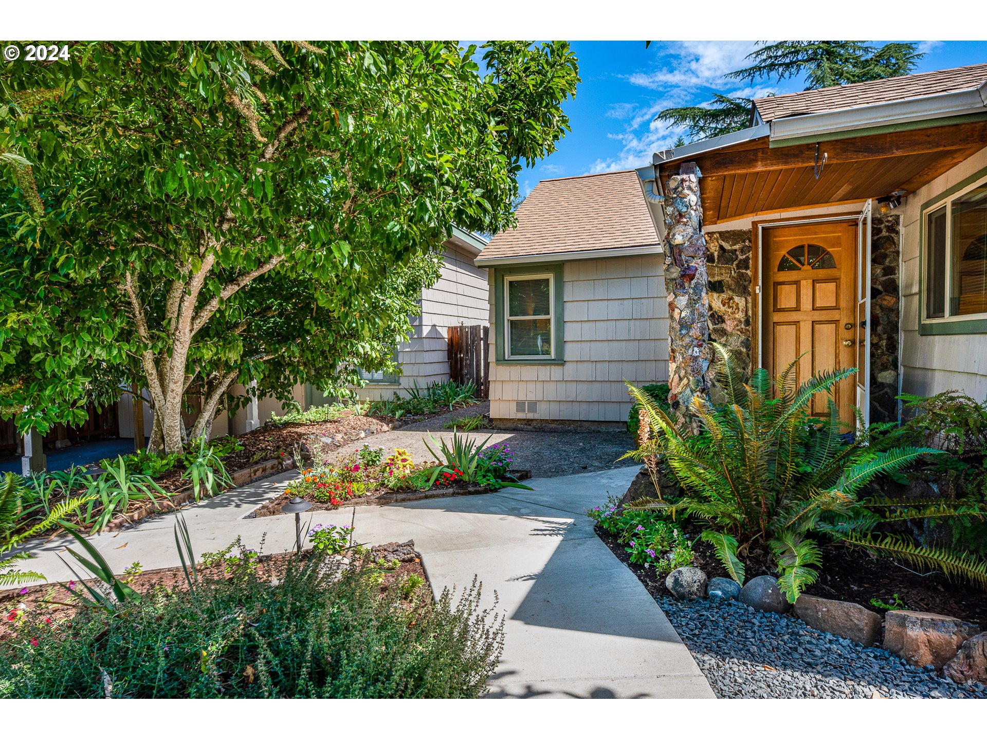 2875 Adams Street Eugene, OR 97405 - Photo 6 of 47 a front view of a house with a yard