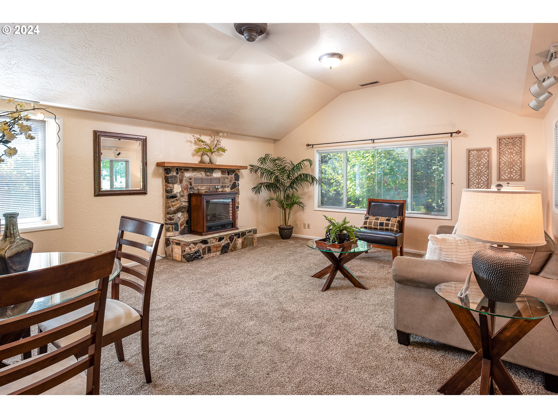 2875 Adams Street Eugene, OR 97405 - Photo 10 of 47 a living room with furniture a window and a flat screen tv