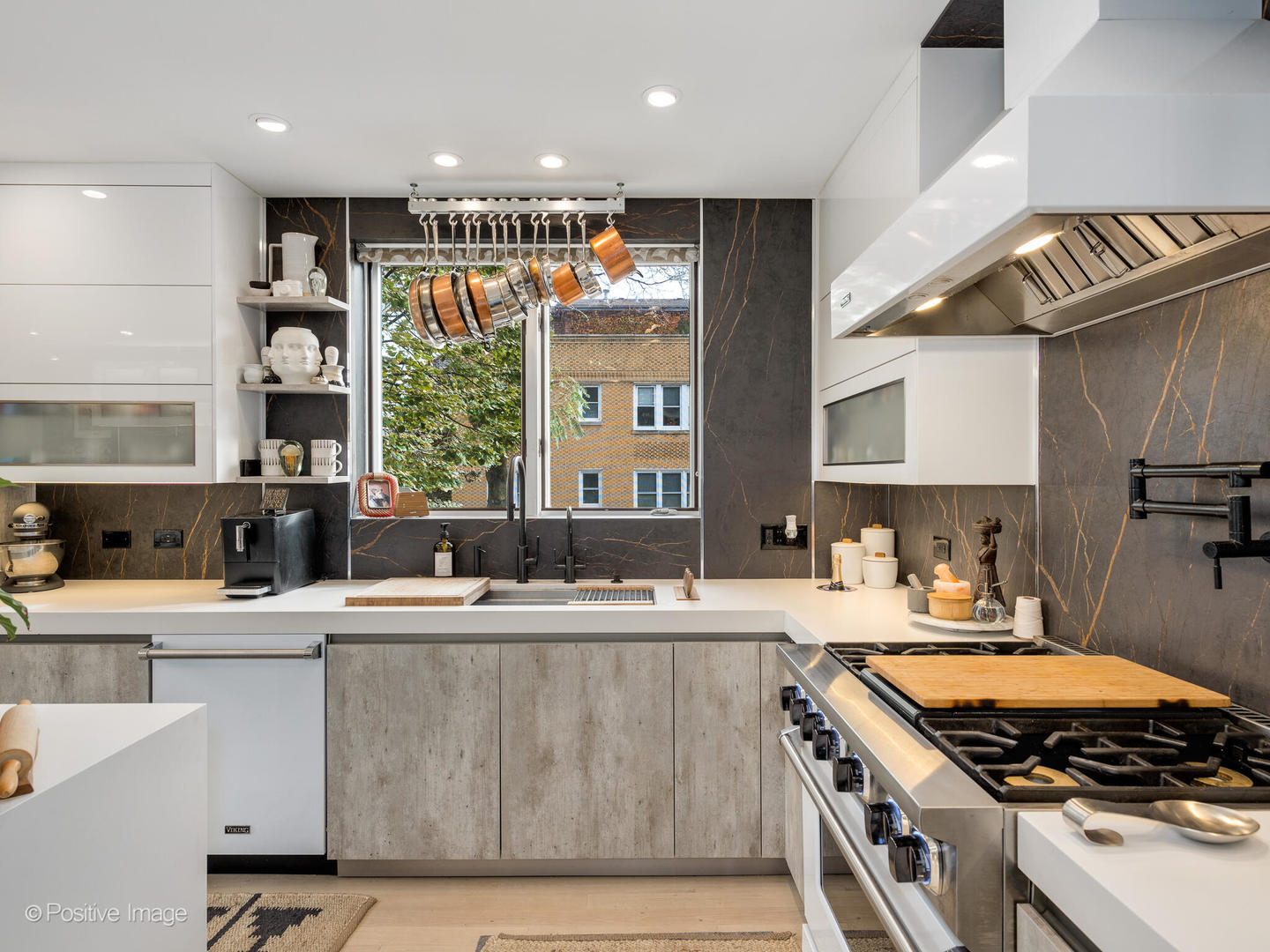 1934 West Armitage Avenue, Unit 2 Chicago, IL 60622 - Photo 11 of 33 a kitchen with a stove a sink and a refrigerator
