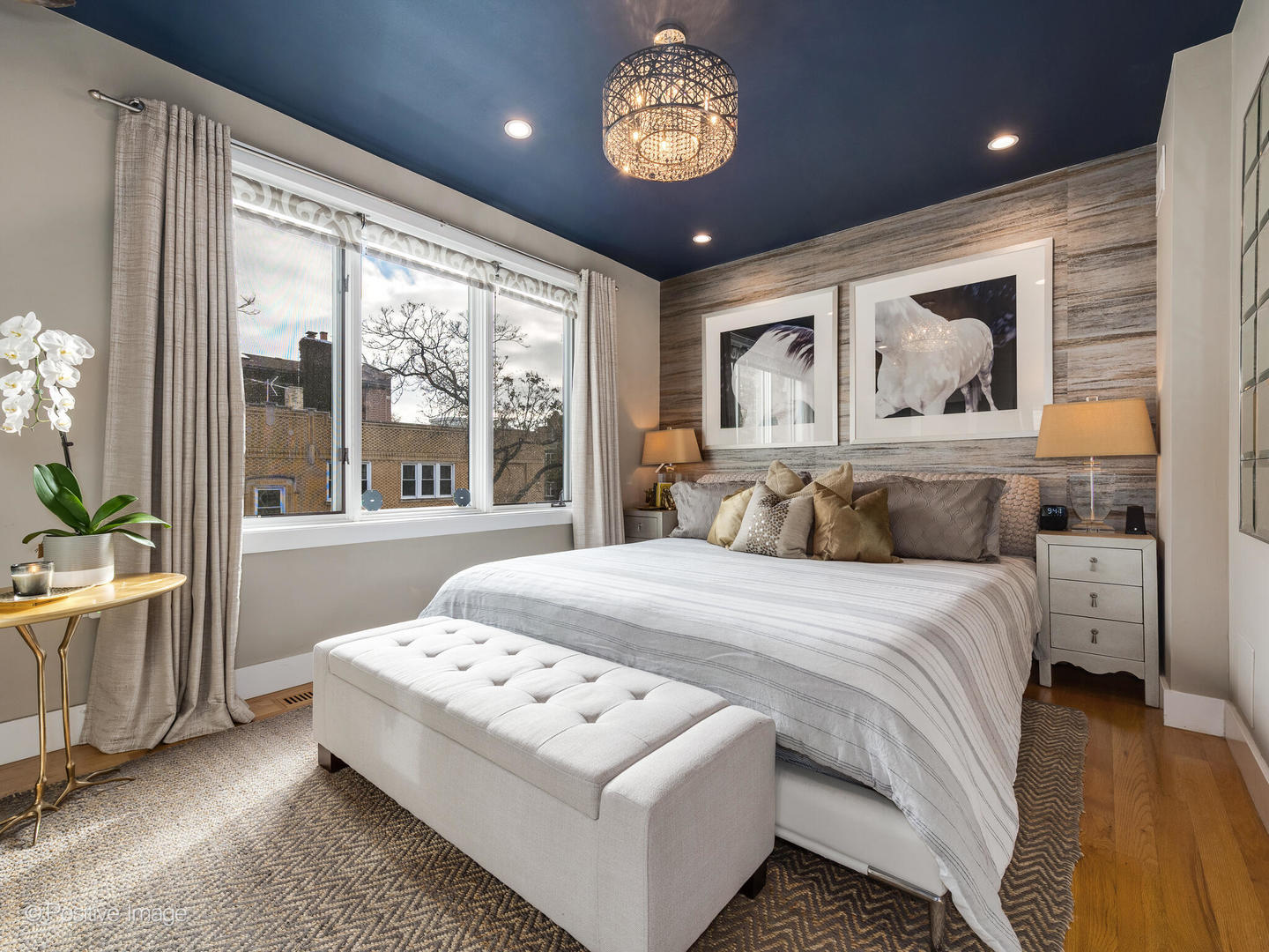1934 West Armitage Avenue, Unit 2 Chicago, IL 60622 - Photo 16 of 33 a bedroom with a large bed and a large window