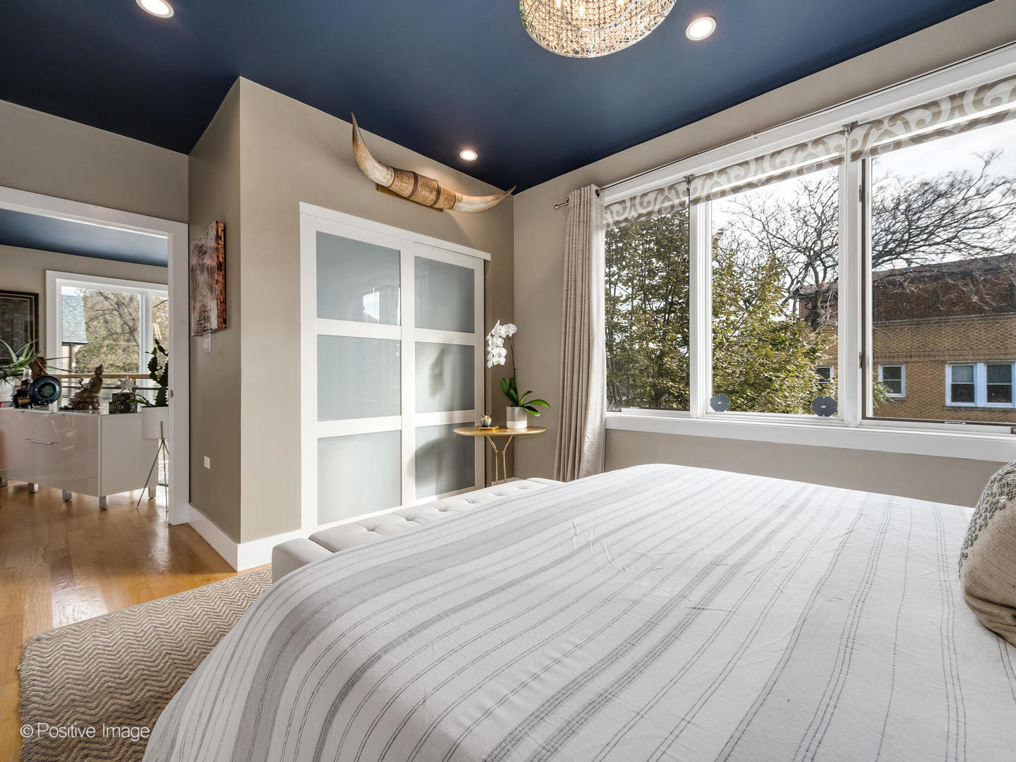 1934 West Armitage Avenue, Unit 2 Chicago, IL 60622 - Photo 17 of 33 a bedroom with a large bed and a large window