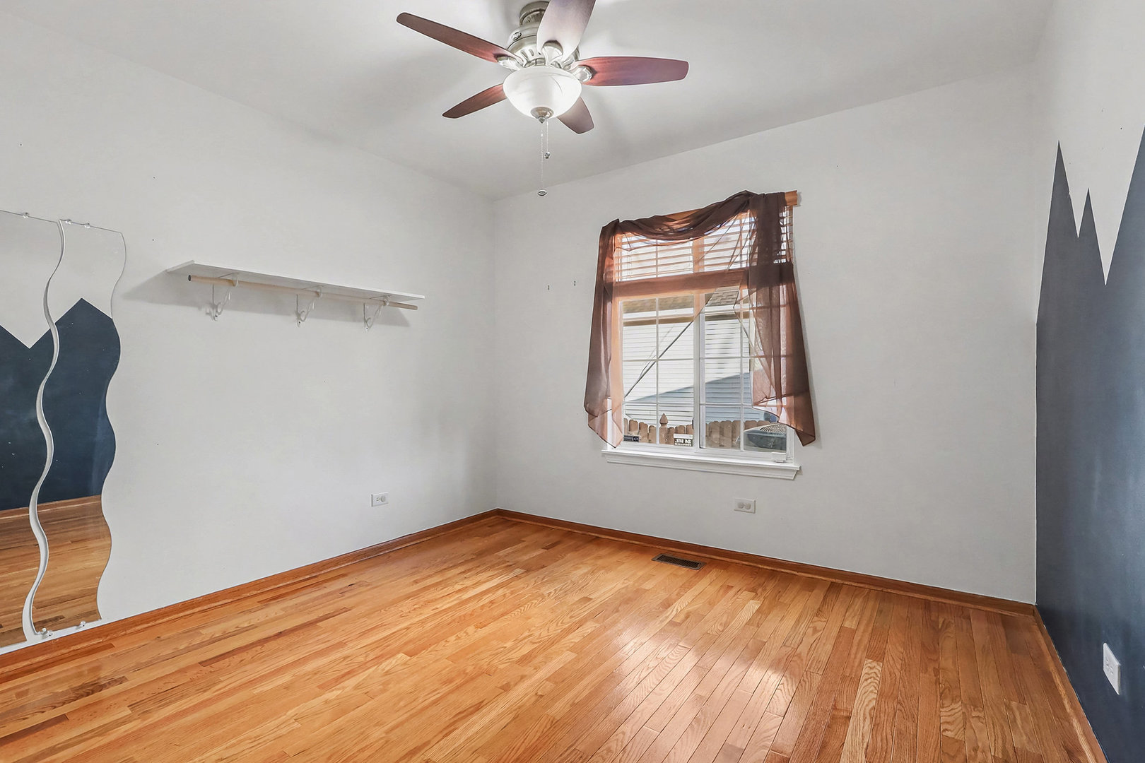 1576 Marigold Lane Minooka, IL 60447 - Photo 11 of 25 a view of empty room with wooden floor and fan