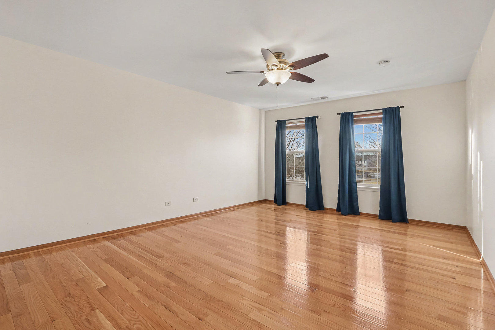 1576 Marigold Lane Minooka, IL 60447 - Photo 12 of 25 a view of an empty room with wooden floor and a window
