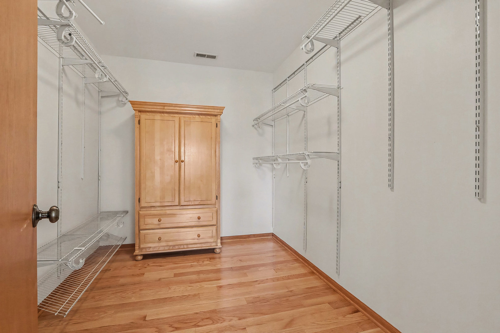 1576 Marigold Lane Minooka, IL 60447 - Photo 13 of 25 a view of walk in closet with empty racks