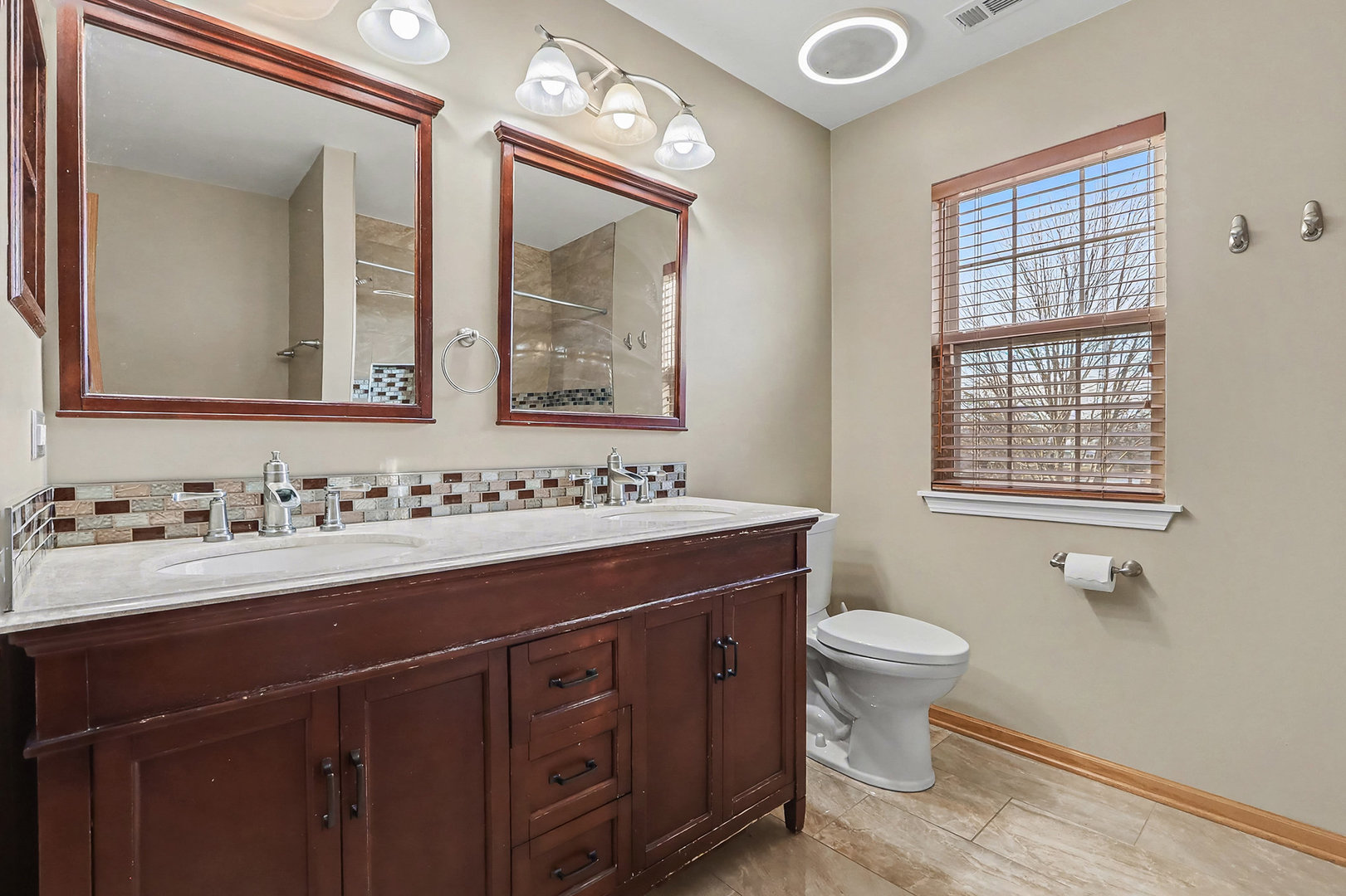 1576 Marigold Lane Minooka, IL 60447 - Photo 14 of 25 a bathroom with a toilet sink and mirror