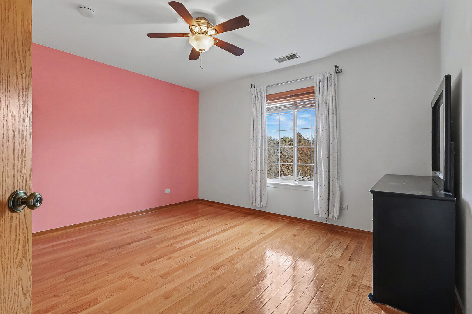 1576 Marigold Lane Minooka, IL 60447 - Photo 15 of 25 a view of empty room with wooden floor and fan
