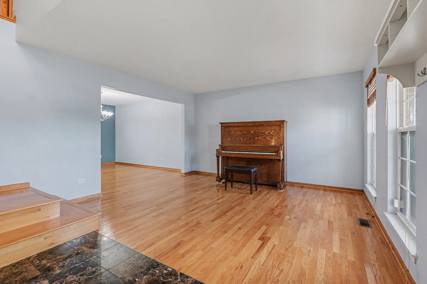 1576 Marigold Lane Minooka, IL 60447 - Photo 2 of 25 a view of an empty room with wooden floor and bench