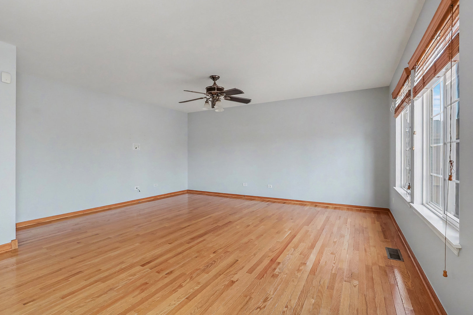 1576 Marigold Lane Minooka, IL 60447 - Photo 9 of 25 a view of a room with wooden floor and fan