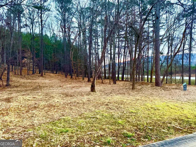 a view of a road with a building in the background