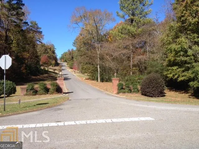 a view of swimming pool with outdoor seating and yard
