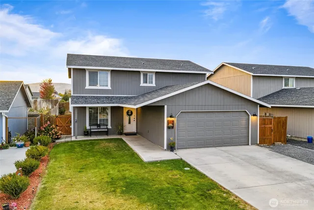 a backyard of a house with yard and garage