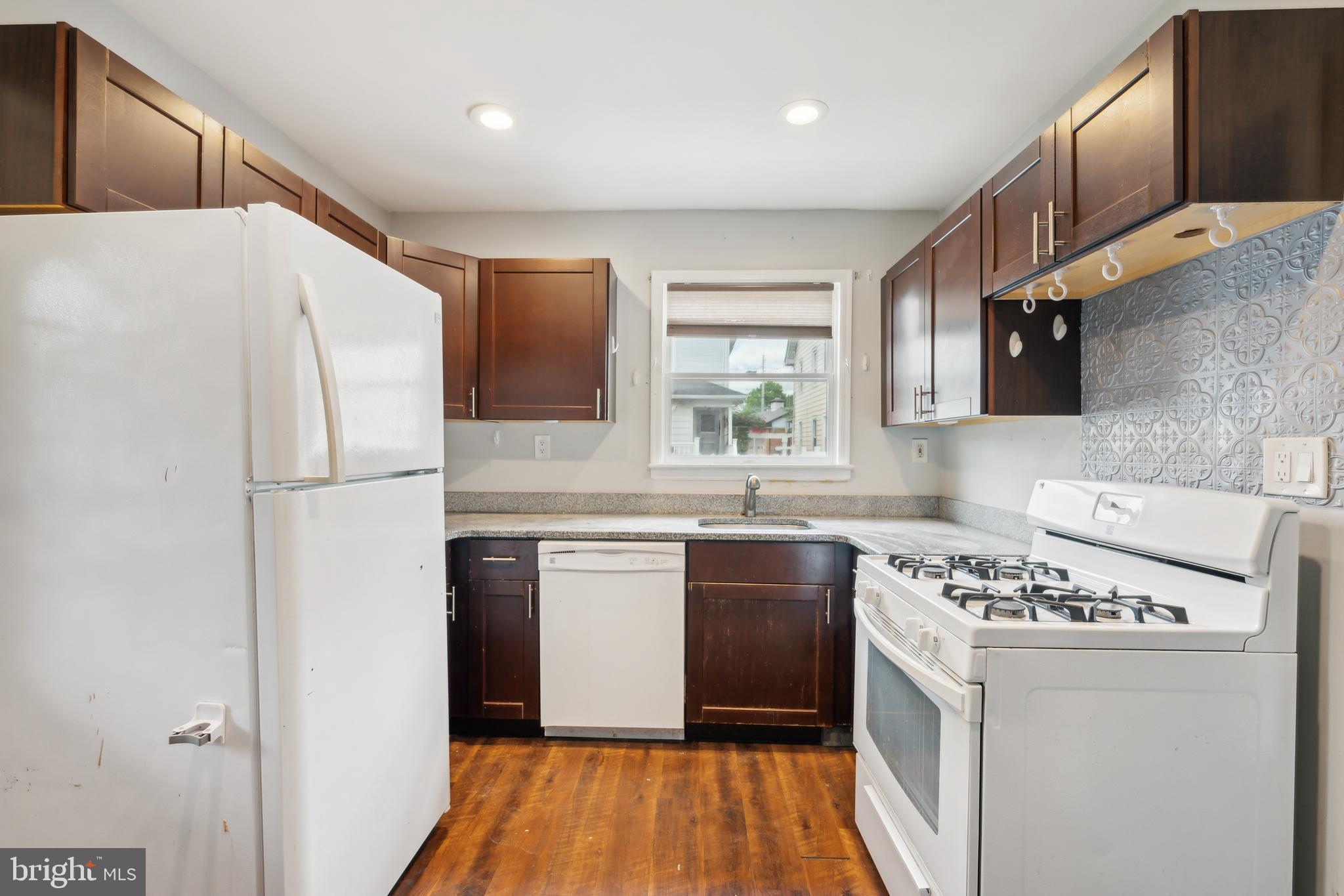 36 Lee Street Riverside, NJ 08075 - Photo 17 of 21 a kitchen with stainless steel appliances a refrigerator sink and stove