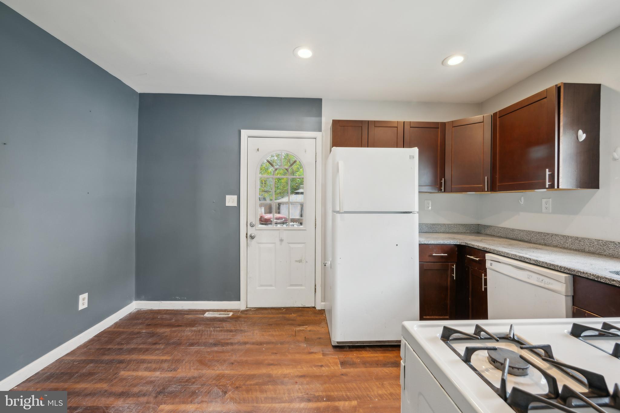 36 Lee Street Riverside, NJ 08075 - Photo 4 of 21 a kitchen with a refrigerator and a stove top oven