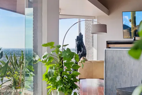 a kitchen with a dining table chairs and window